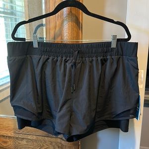 Athletic shorts with attached shorts underneath.